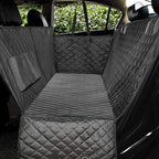 Water-resistant dog car seat hammock covering a car back seat